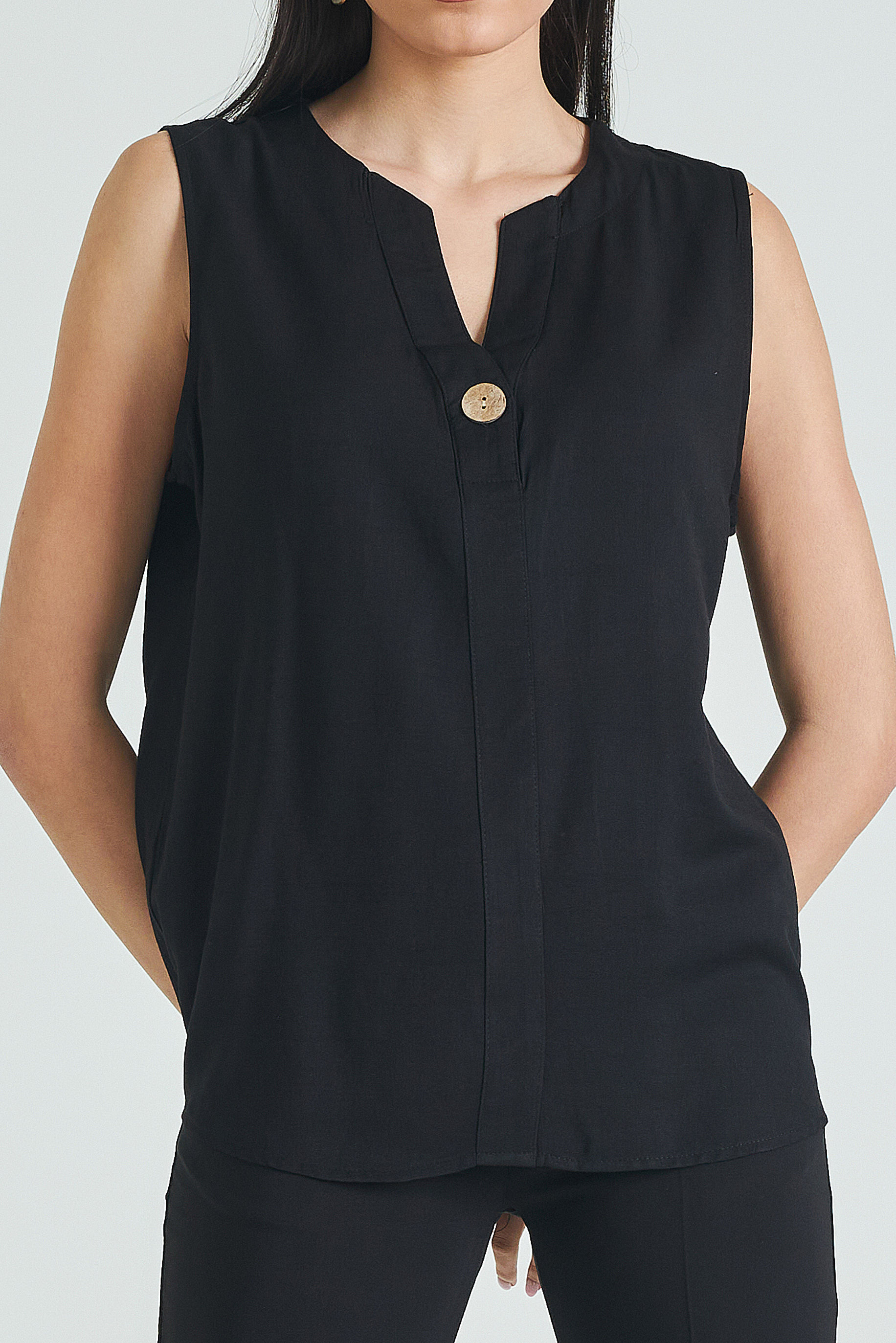 Picture of Sleeveless blouse with button